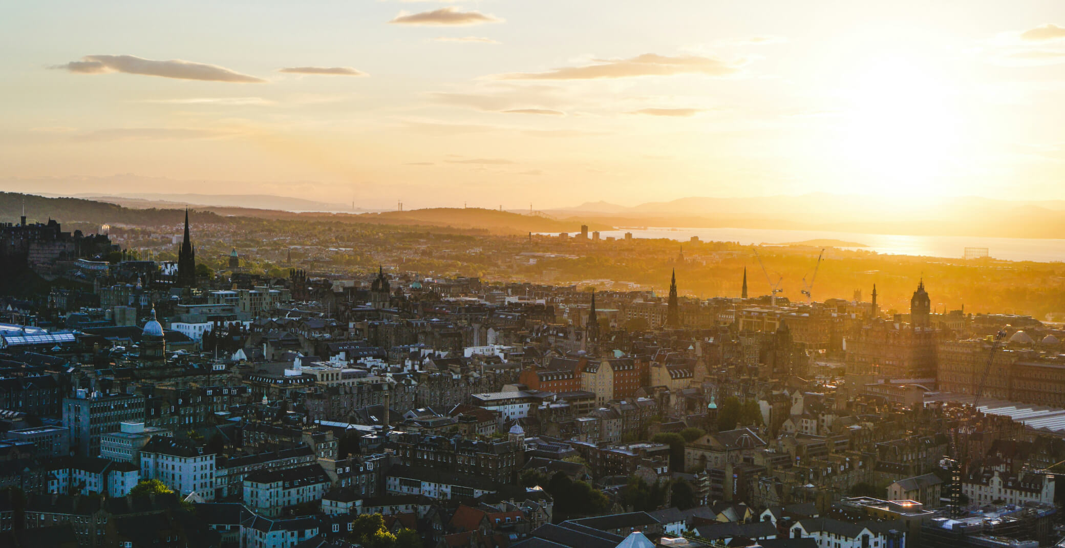 A glowing orange sunset over Edinburgh.