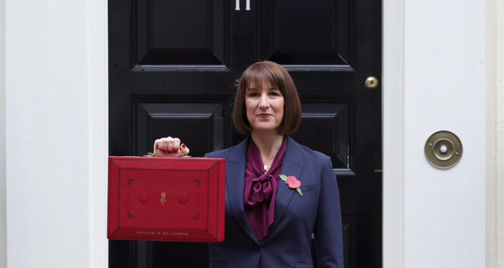 Rachel Reeves stands at the door of number 11 with the red briefcase ahead of the Autumn Budget.